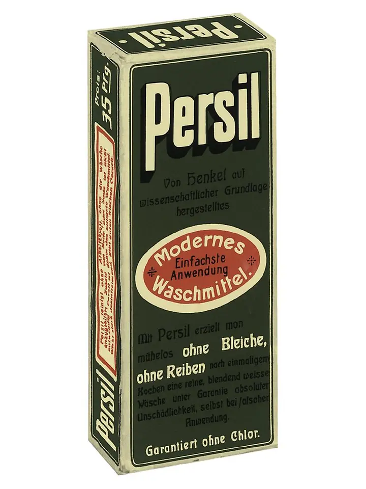 Scatola vintage del detersivo Persil con testo in tedesco ed etichetta ovale rossa che evidenzia la sua applicazione moderna e facile.