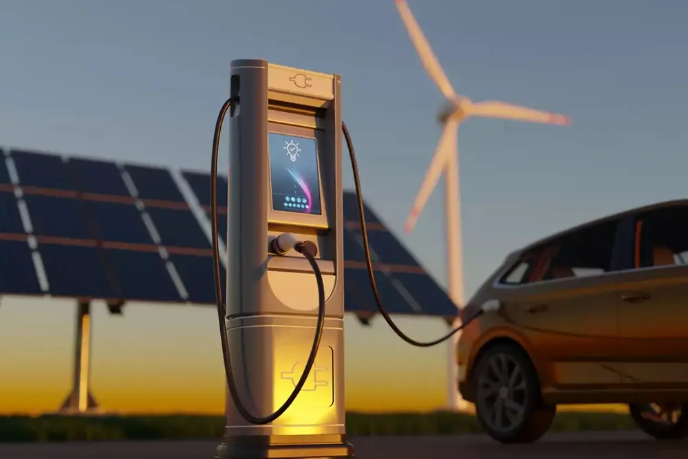 Stazione di ricarica per veicoli elettrici con pannelli solari e turbine eoliche sullo sfondo.
