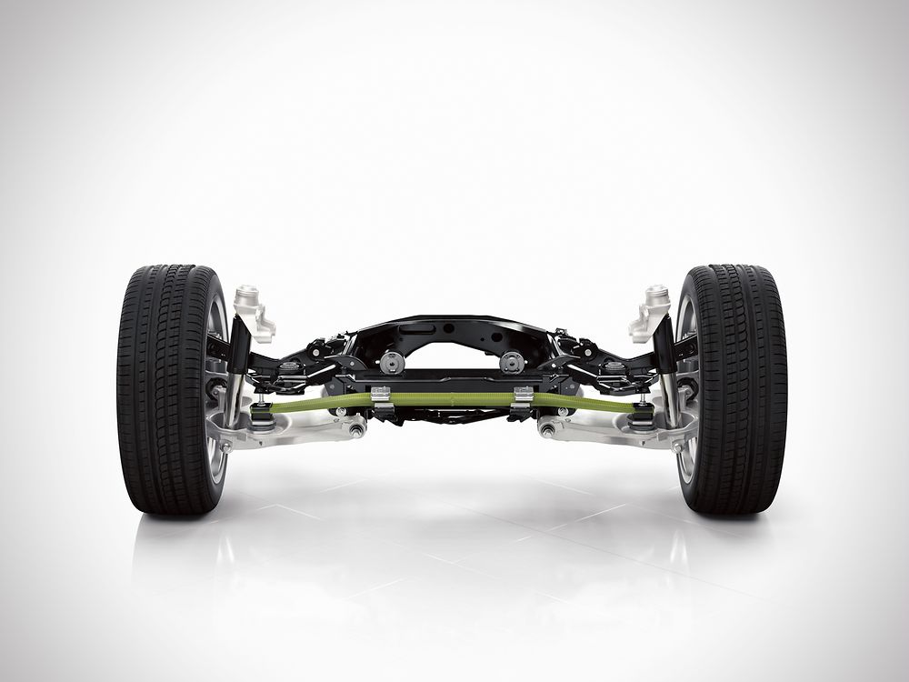 The rear axle with a transverse composite leaf spring